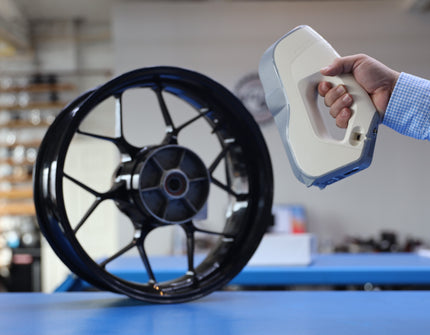 Handheld 3D scanner capturing the shape of an original wheel